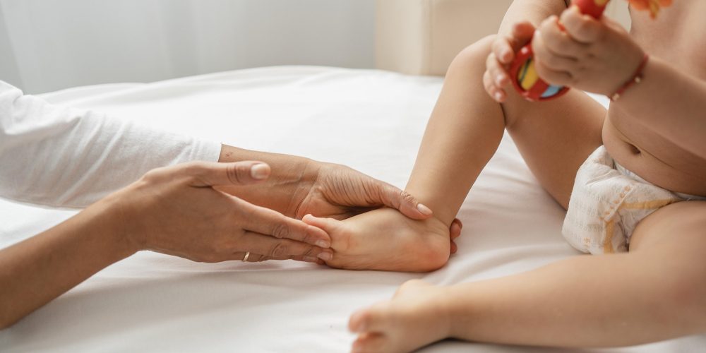 osteopathist-treating-baby-girl-s-feet.jpg
