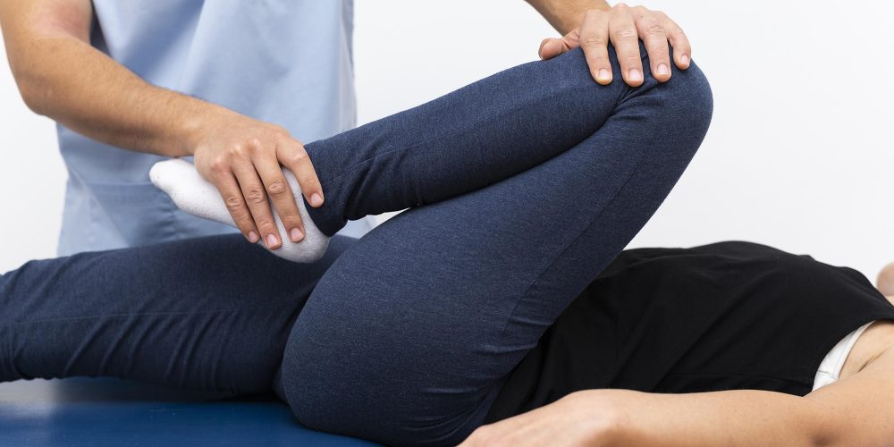physiotherapist-doing-exercises-with-female-patient.jpg